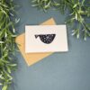 1 Fish A mini card with a single fish design on a green background with a plant