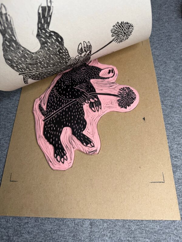 Pulling a print off of the inked Aardvark block